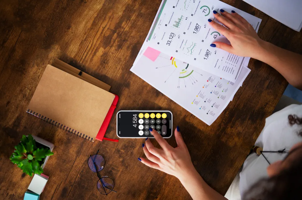 business owner is calculating digital marketing cost in a phone