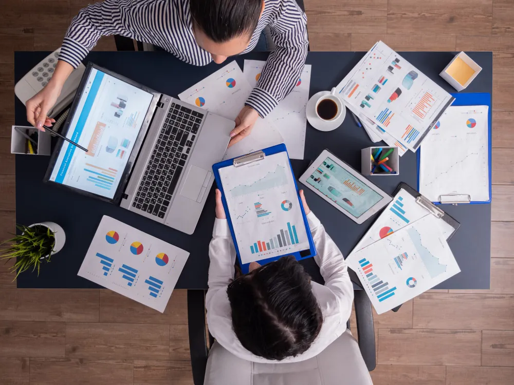 two employee review the seo service perform using laptop and tablet