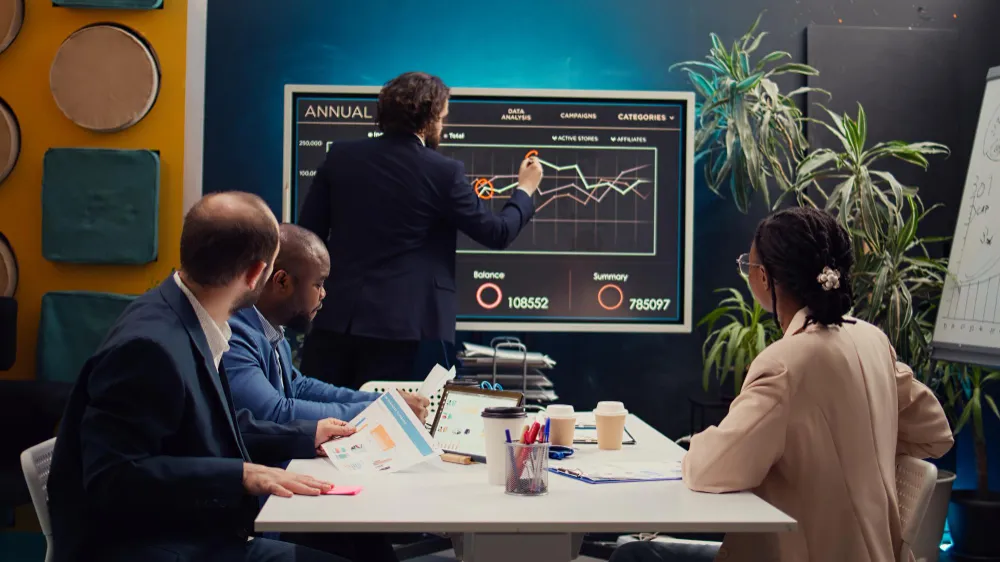 four employee are in the middle of meeting to building a digital marketing strategy